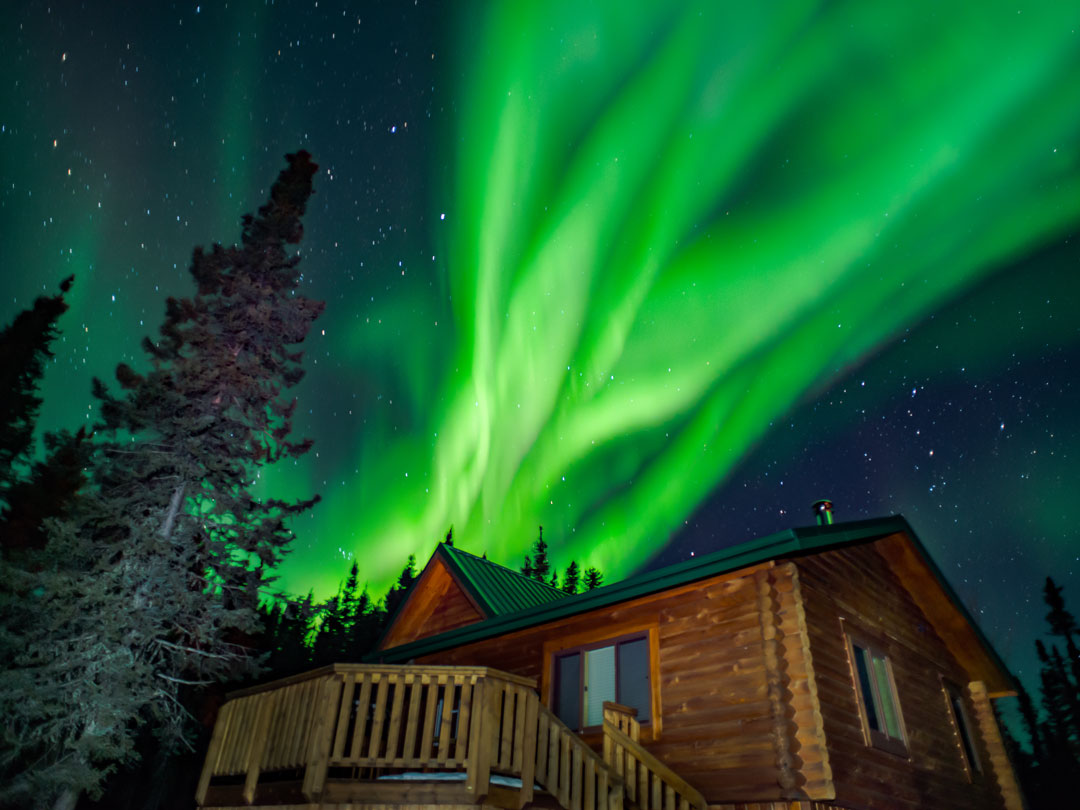 winter cabins at North Haven Resort featuring the Northern Lights